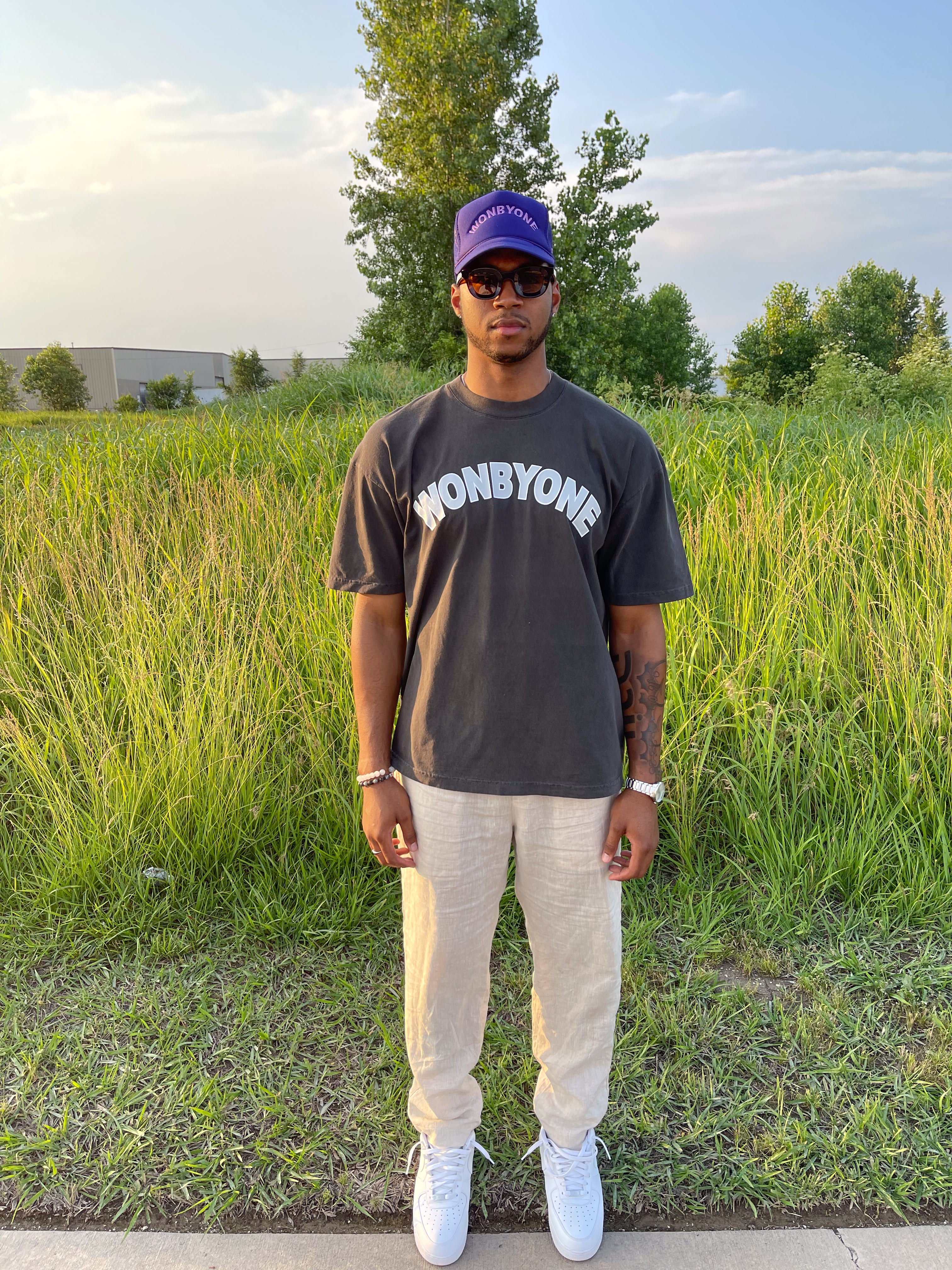 ARCHED LOGO TRUCKER HAT